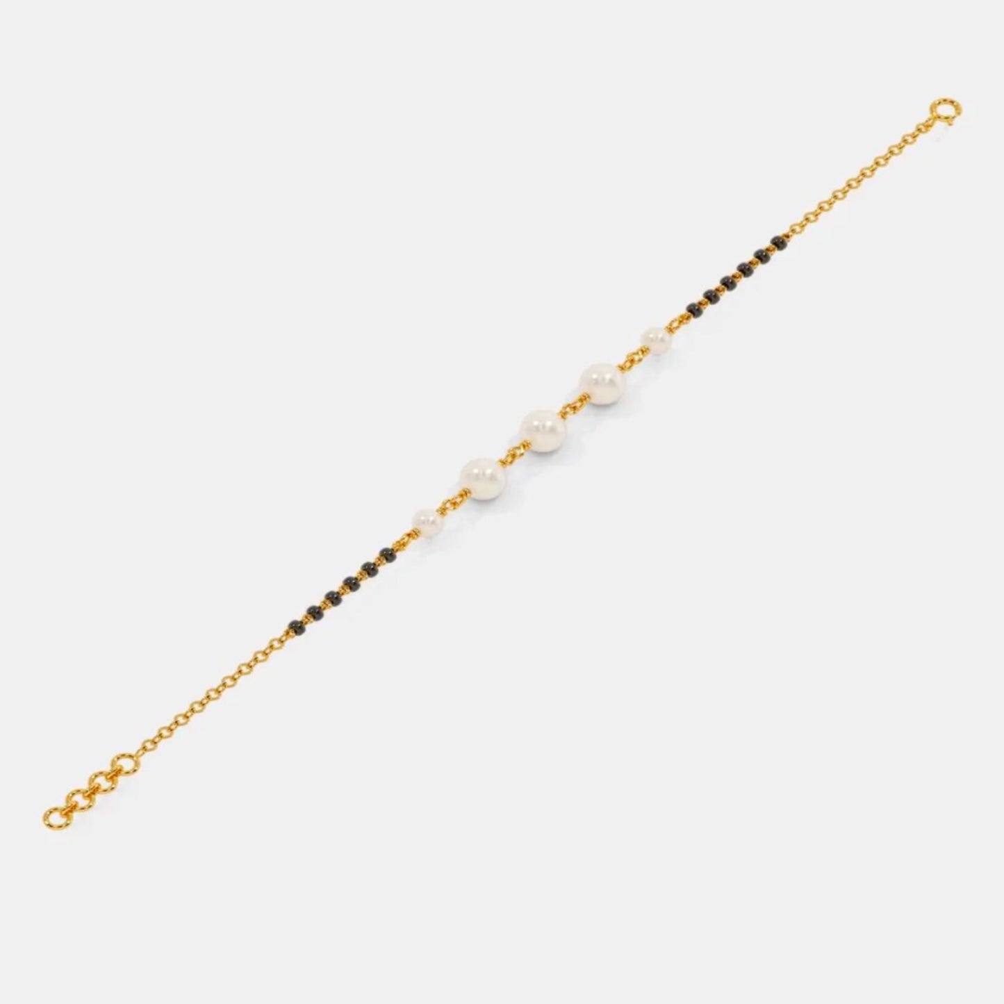 Bracelet with gold chain and beads on a white background