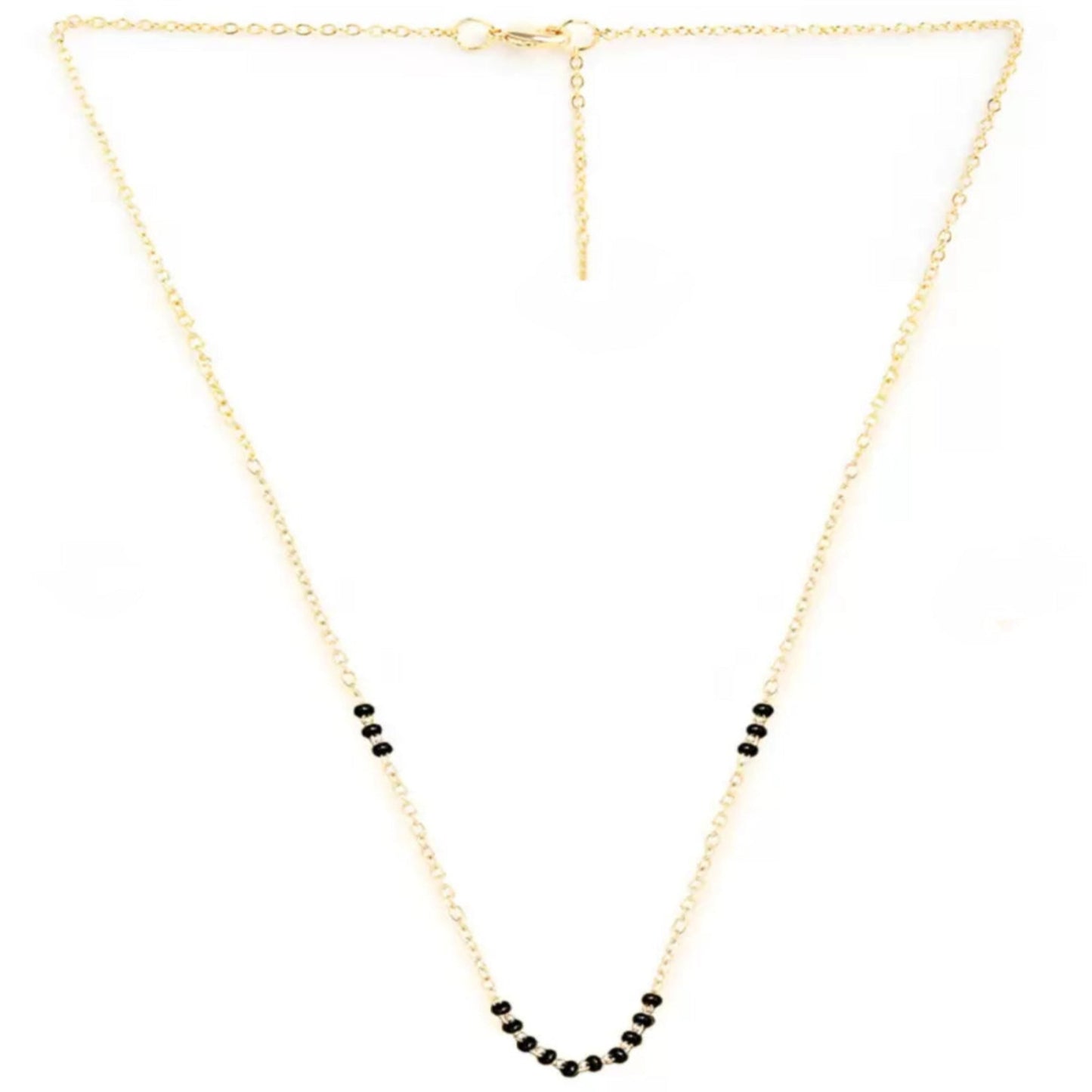 Gold necklace with black beads on a white background