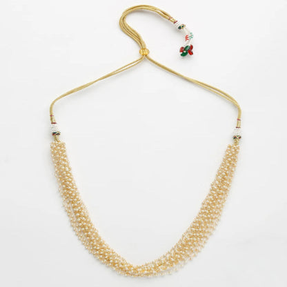 Pearl necklace with gold clasp on a white background