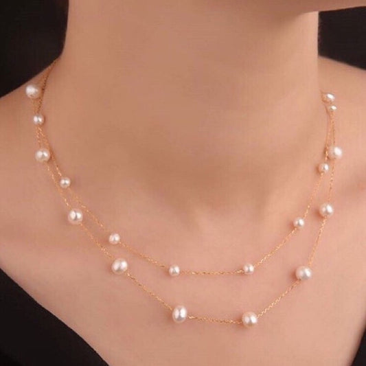 Pearl necklace on a mannequin with a black background