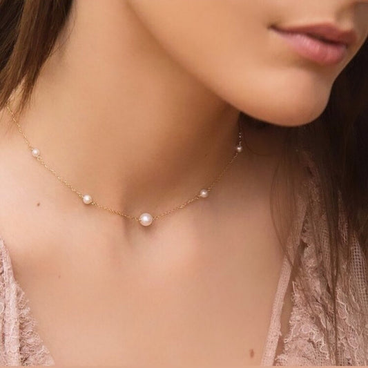 Pearl necklace on a model with a soft focus background