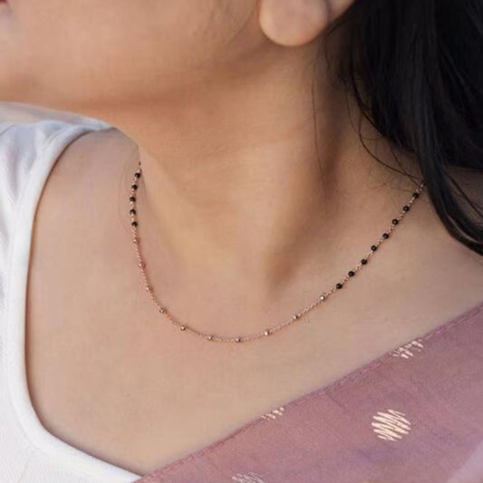 Necklace worn by a person with a blurred background