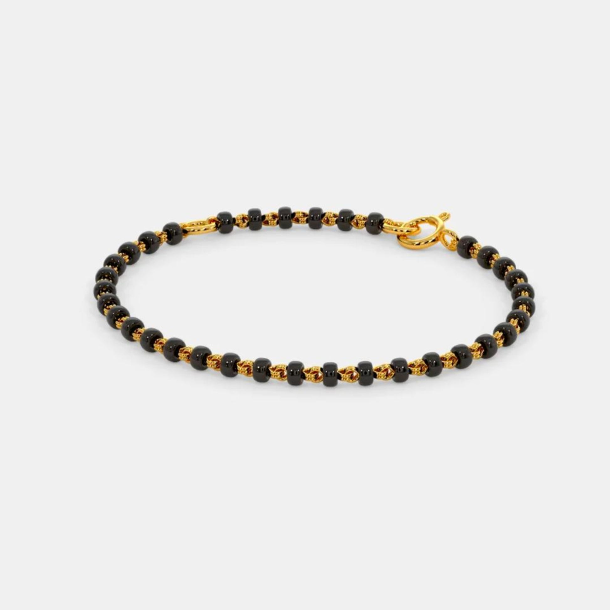 Black and gold beaded bracelet on a white background